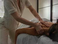 a woman getting a massage in a room